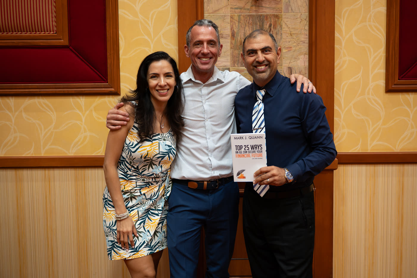 Mark Quann with two attendees at Elevate 2026